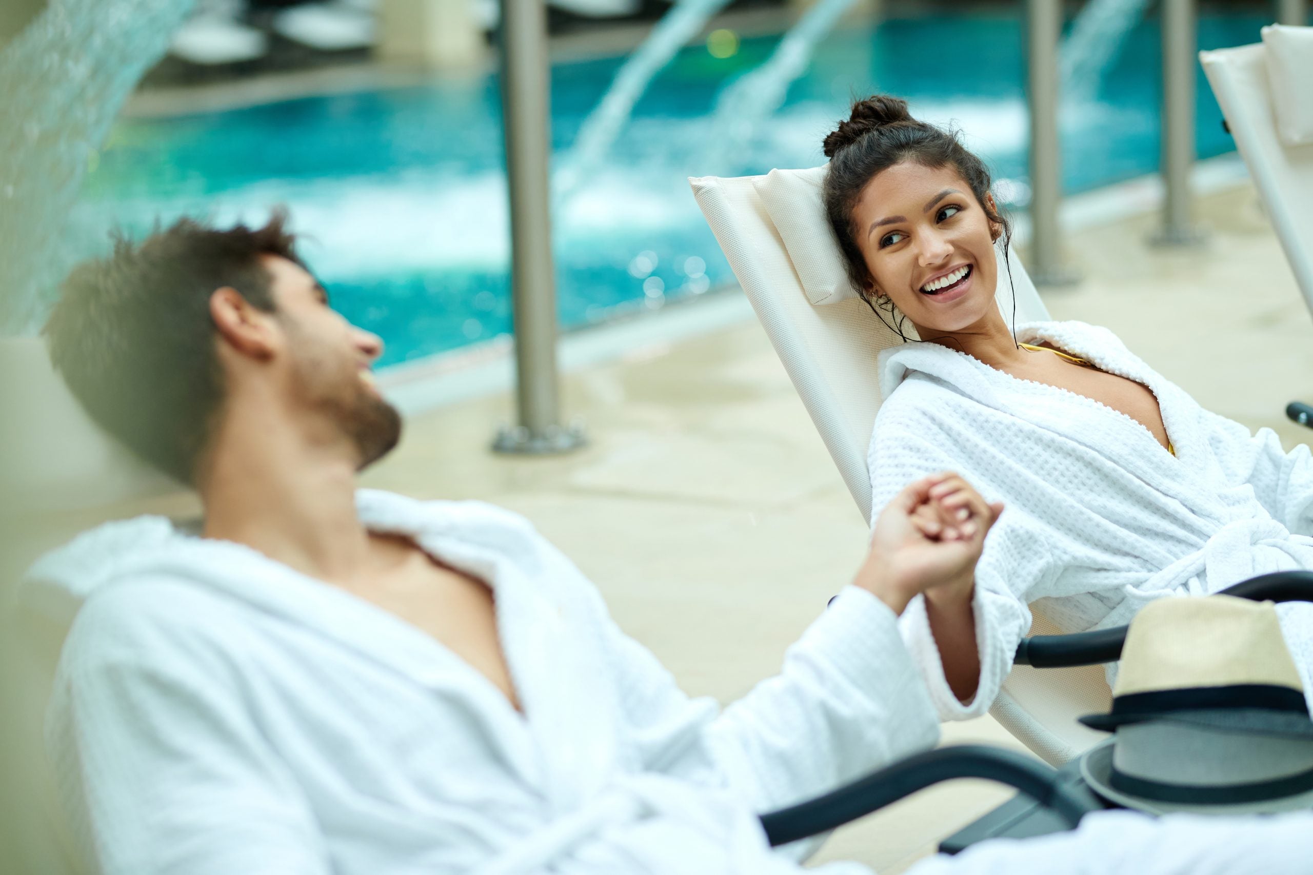 happy-couple-holding-hands-and-talking-while-relax-2026-01-06-10-41-31-utc